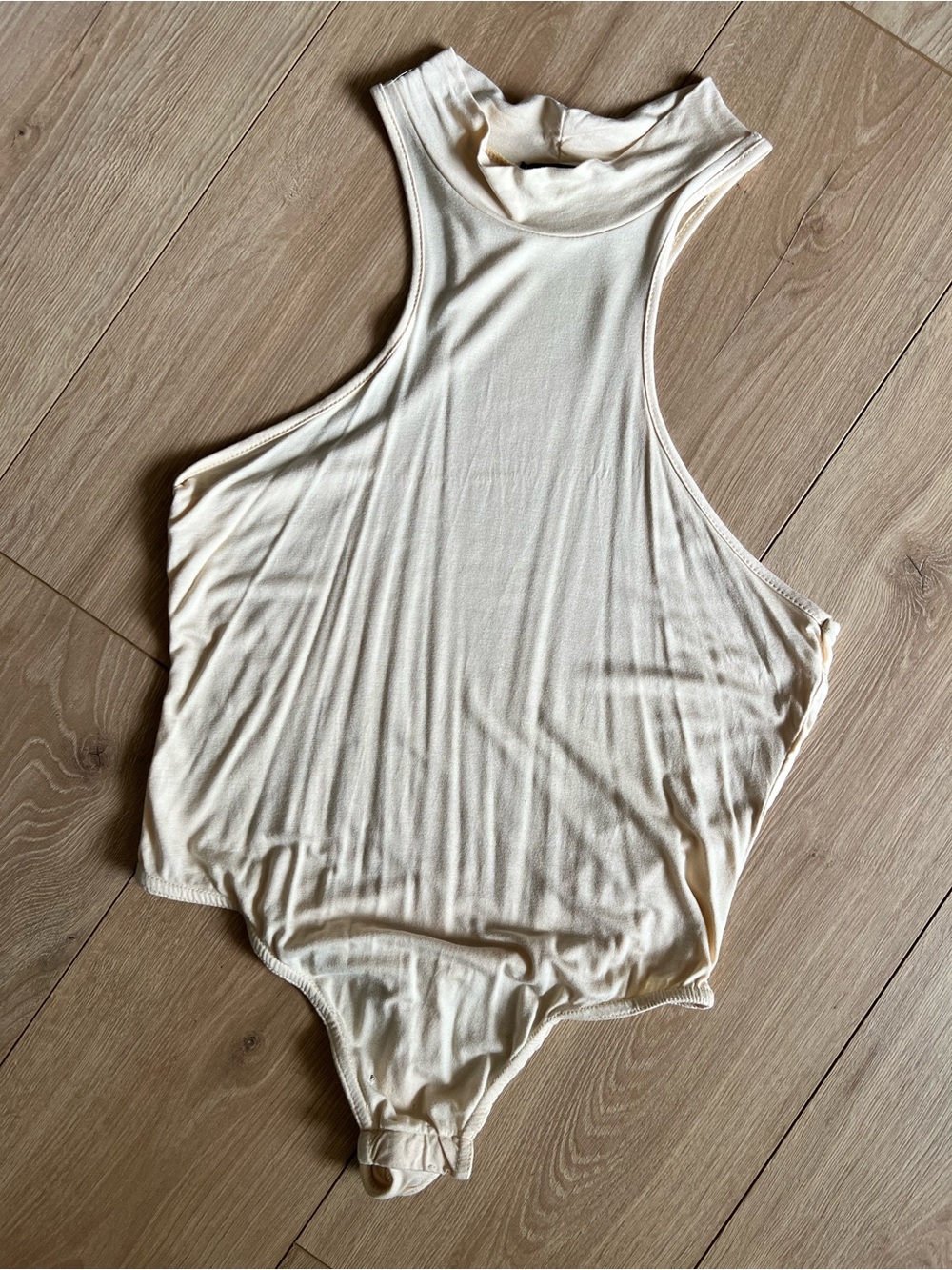 PrettyLittleThing Sleeveless Mock Neck Bodysuit in Cream